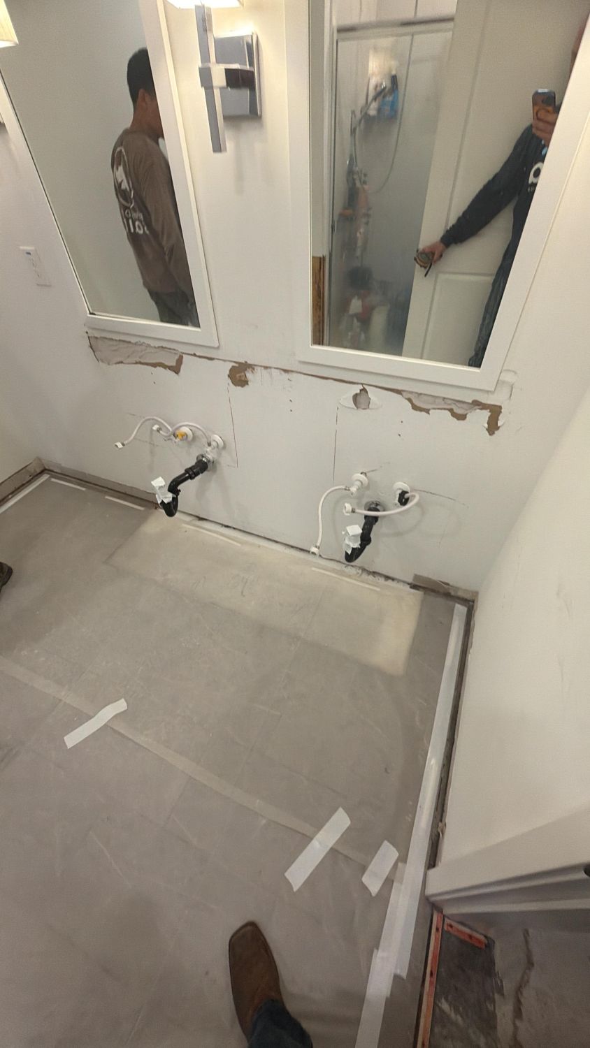 Vanity removal and baseboard demolition in water damaged bathroom