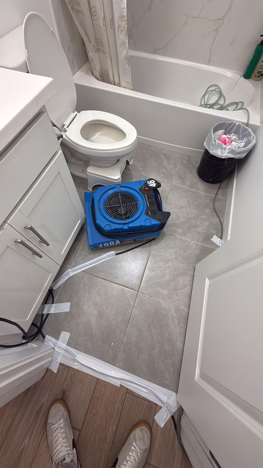 Bathroom after water damage restoration with surfaces cleaned and dried