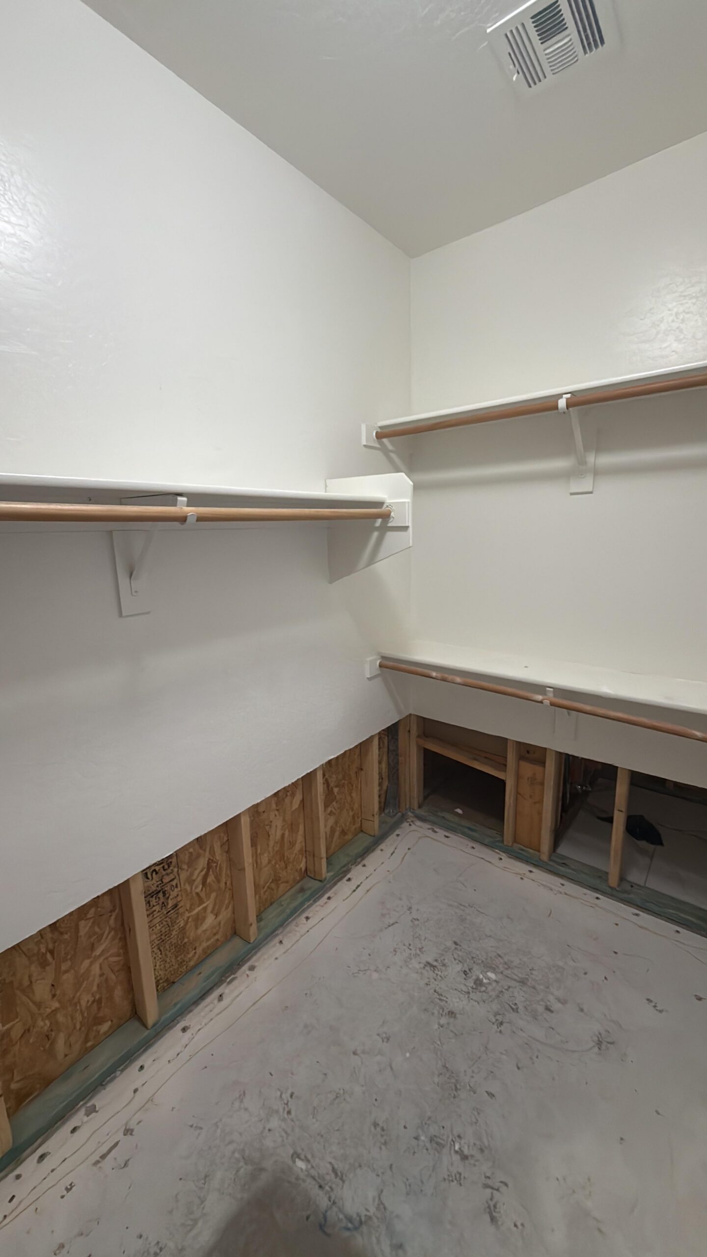 Completed water damage mitigation showing clean dried room ready for rebuild