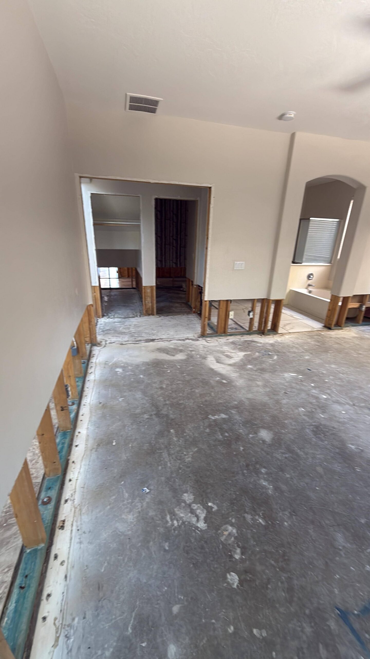 Kitchen area after water damage mitigation with exposed framing ready for rebuild