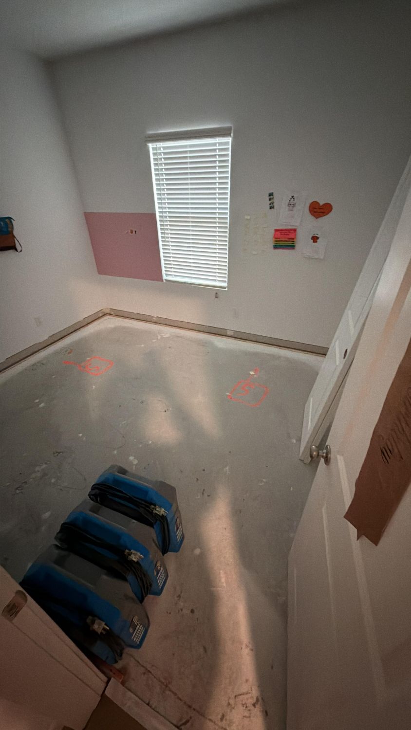 Great room showing completed water damage mitigation with clean exposed surfaces