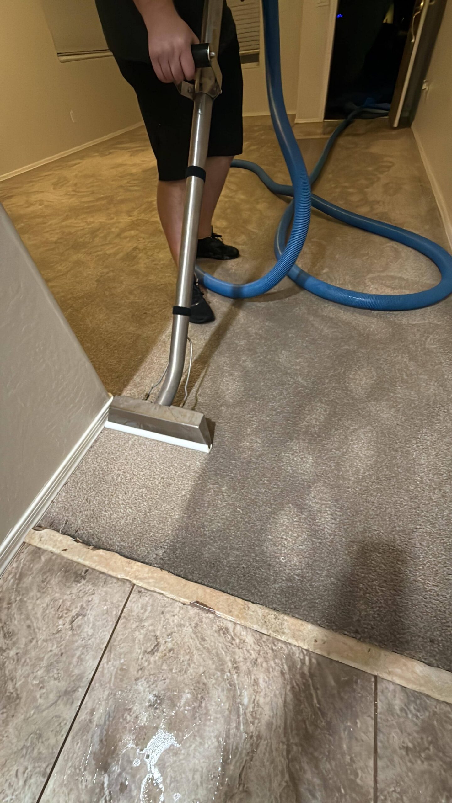 Continued water extraction from heavily saturated carpet in residential living area