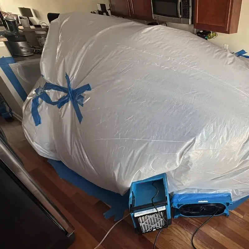 Containment Chamber Setup Around Kitchen Cabinets And Flooring