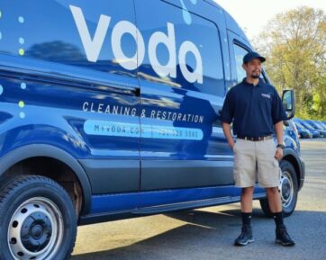 Voda Cleaning & Restoration Employee with Voda Van