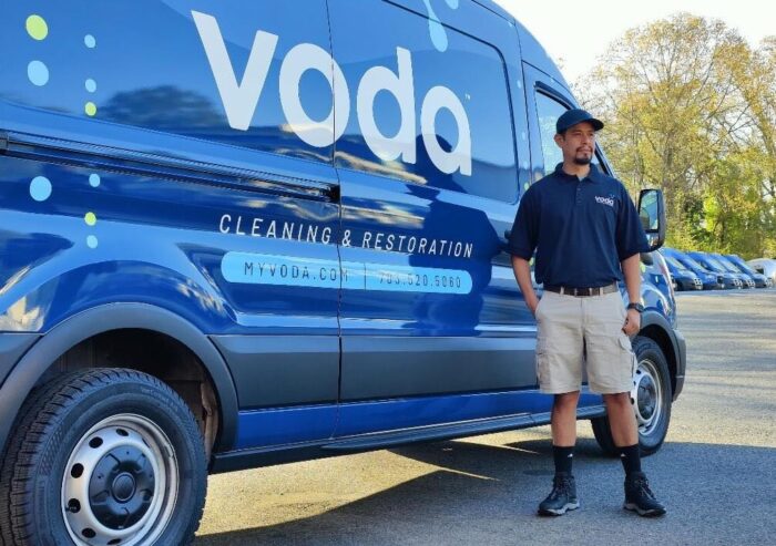 Voda Cleaning & Restoration Employee with Voda Van